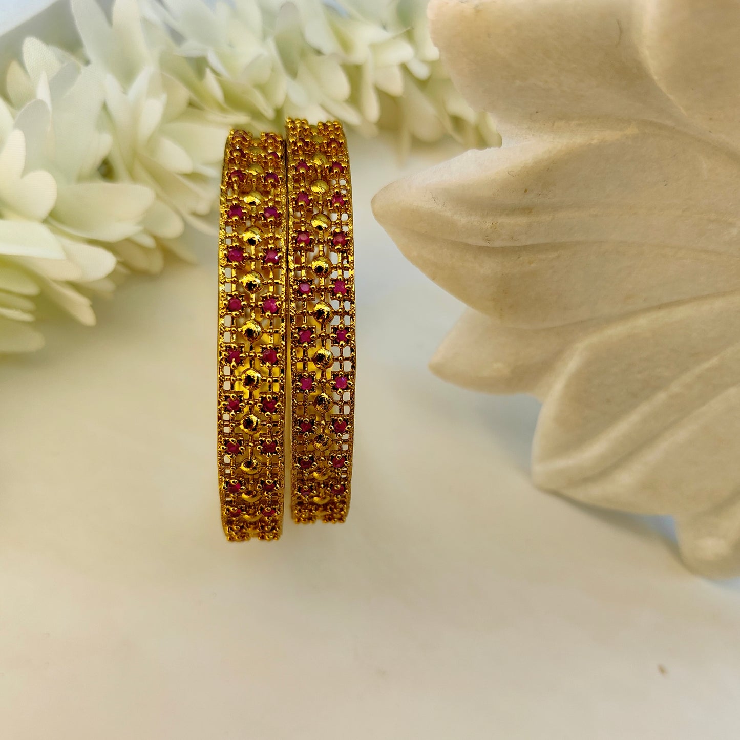 Ruby gold pleated set of two bangles