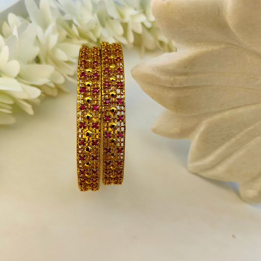 Ruby gold pleated set of two bangles