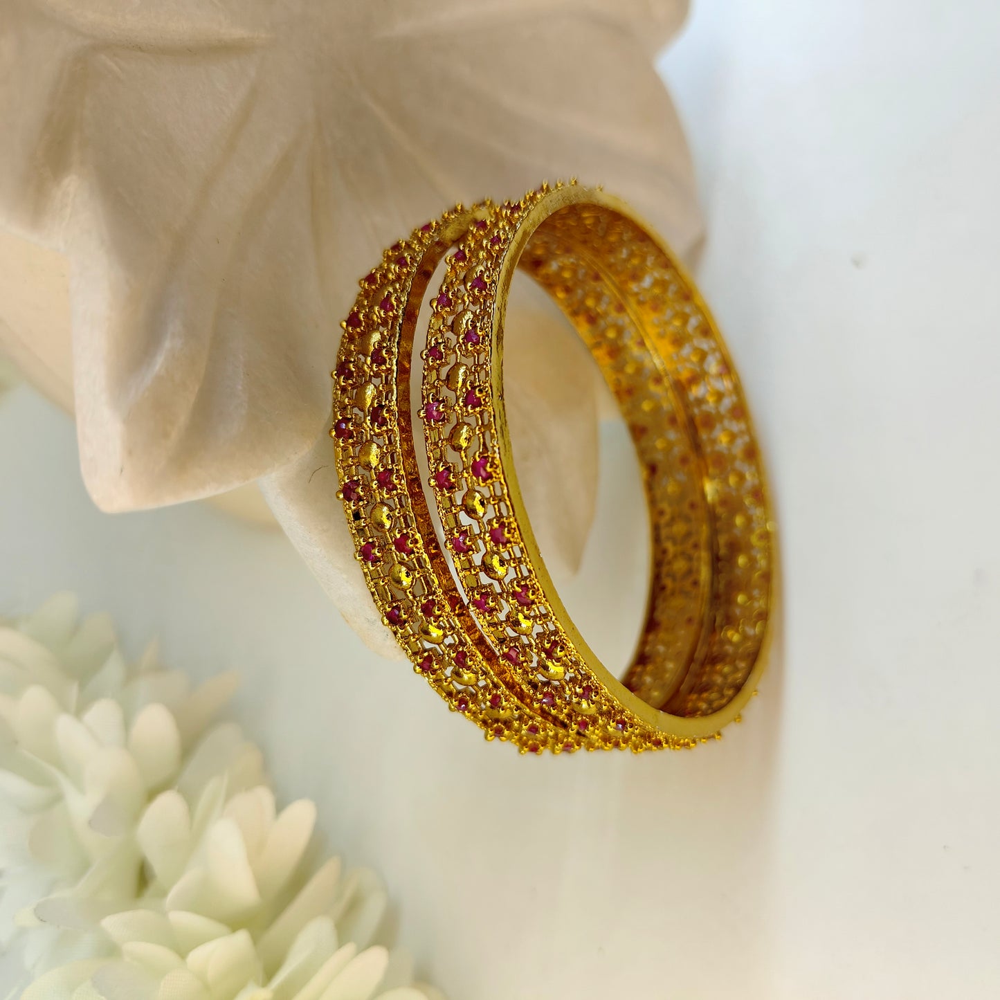 Ruby gold pleated set of two bangles
