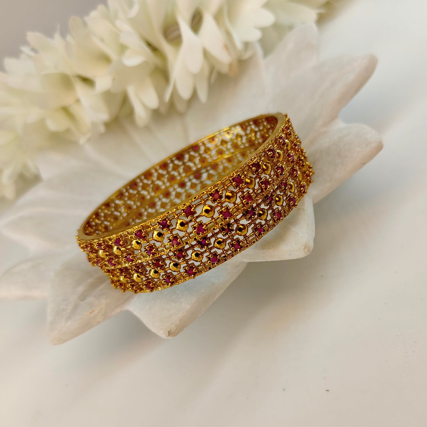Ruby gold pleated set of two bangles