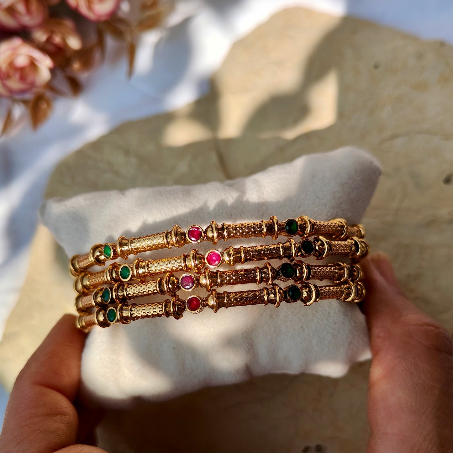 Set of four (non-openable) bangles with Ruby green Kundan work