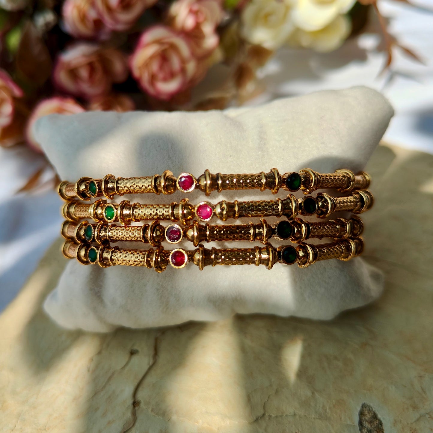 Set of four (non-openable) bangles with Ruby green Kundan work